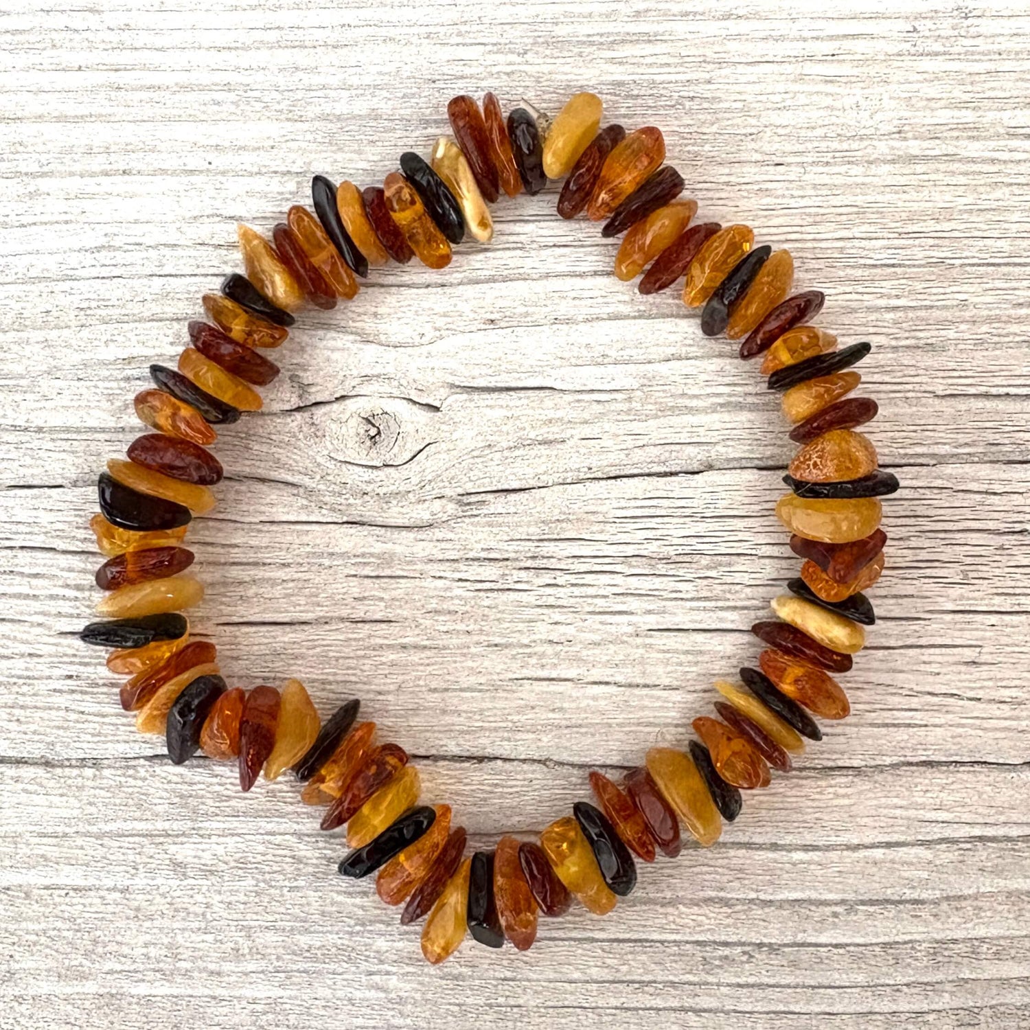 beaded amber bracelet on wooden urface