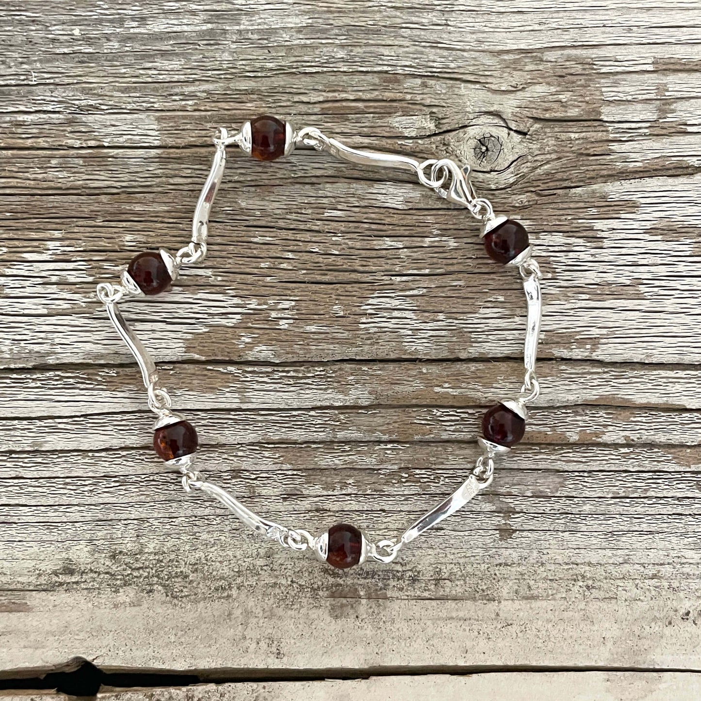 Sterling silver bracelet with round cognac amber set in sterling silver