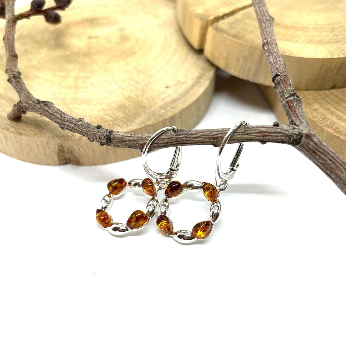 round shaped sterling silver earrings with amber