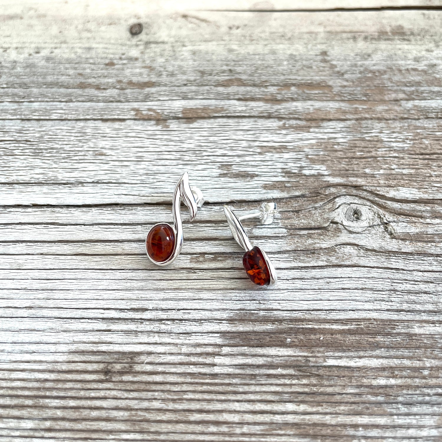 sterling silver cognac coloured amber earrings shaped in a treble clef