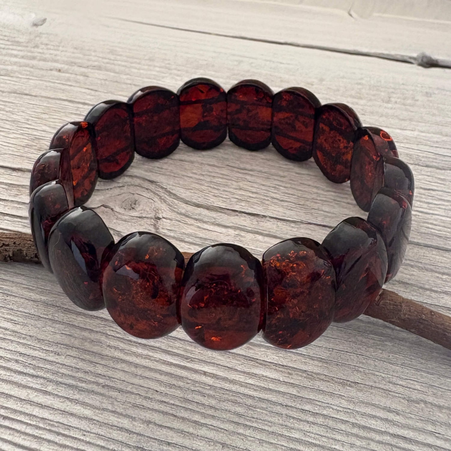 Beaded bracelet with brown beads on a wooden surface