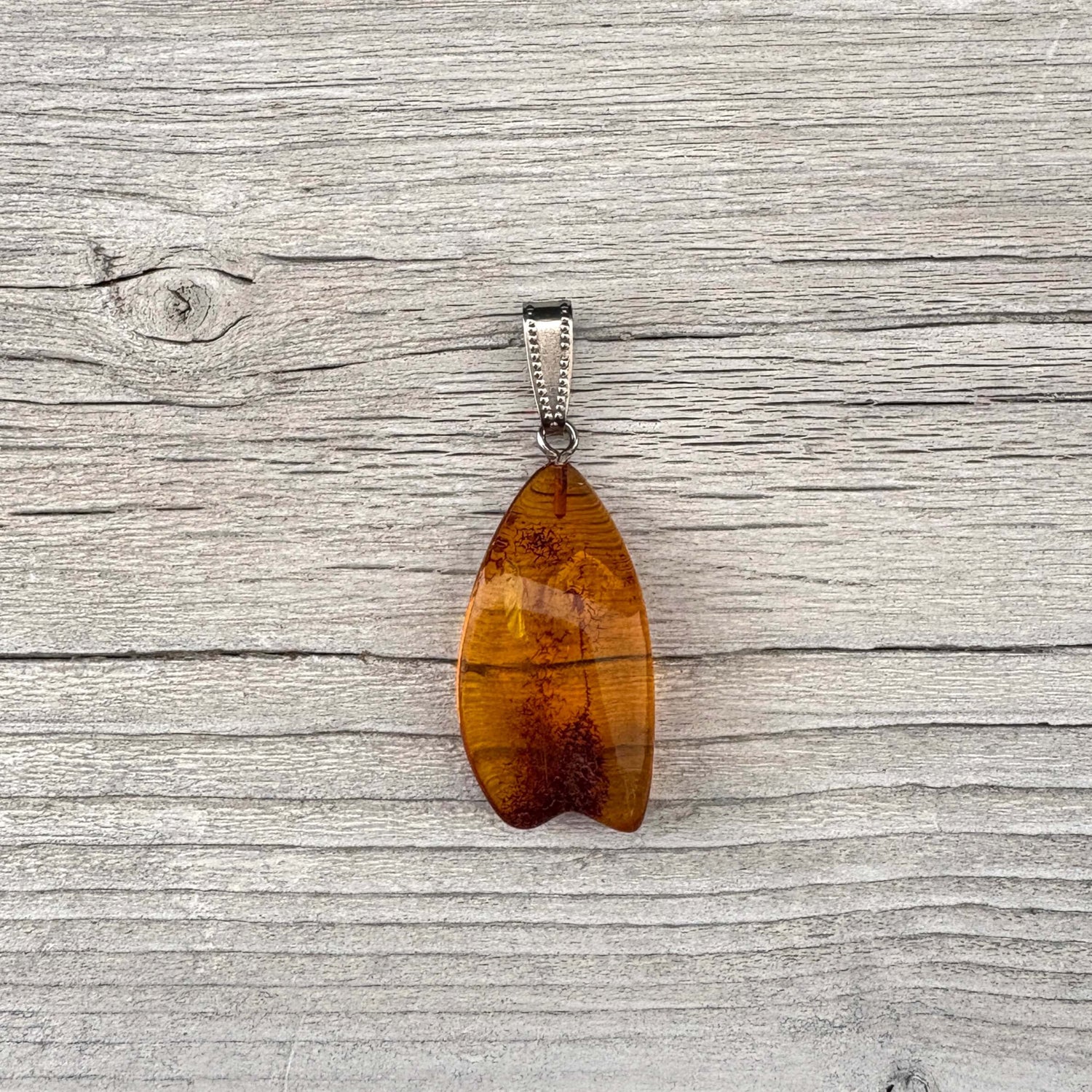 Baltic amber pendant with silver link front