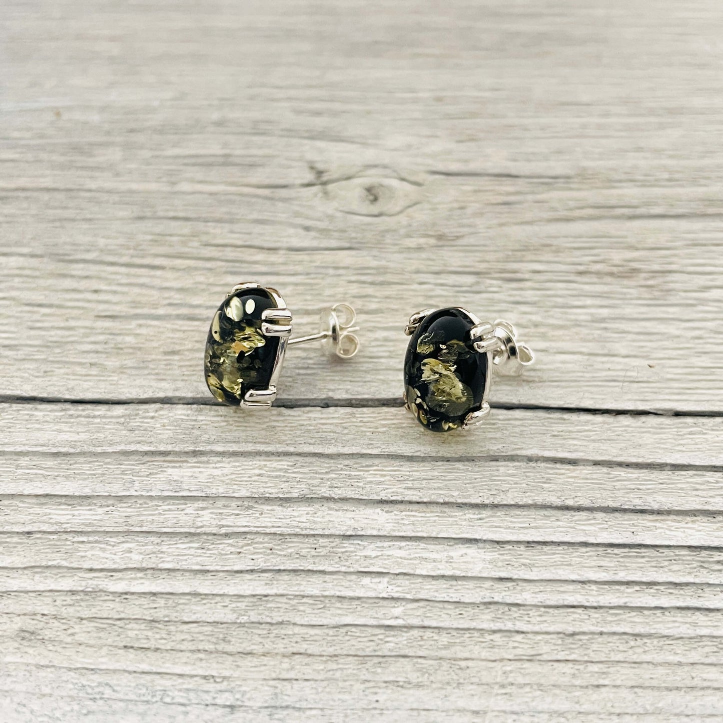 oval shaped green amber stud earrings