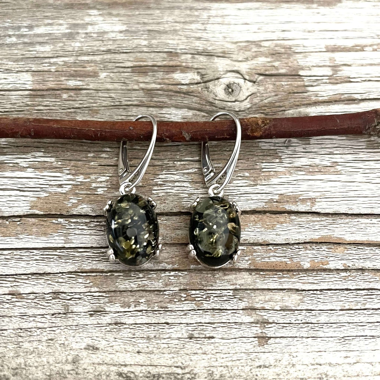 oval shaped green amber sterling silver earrings
