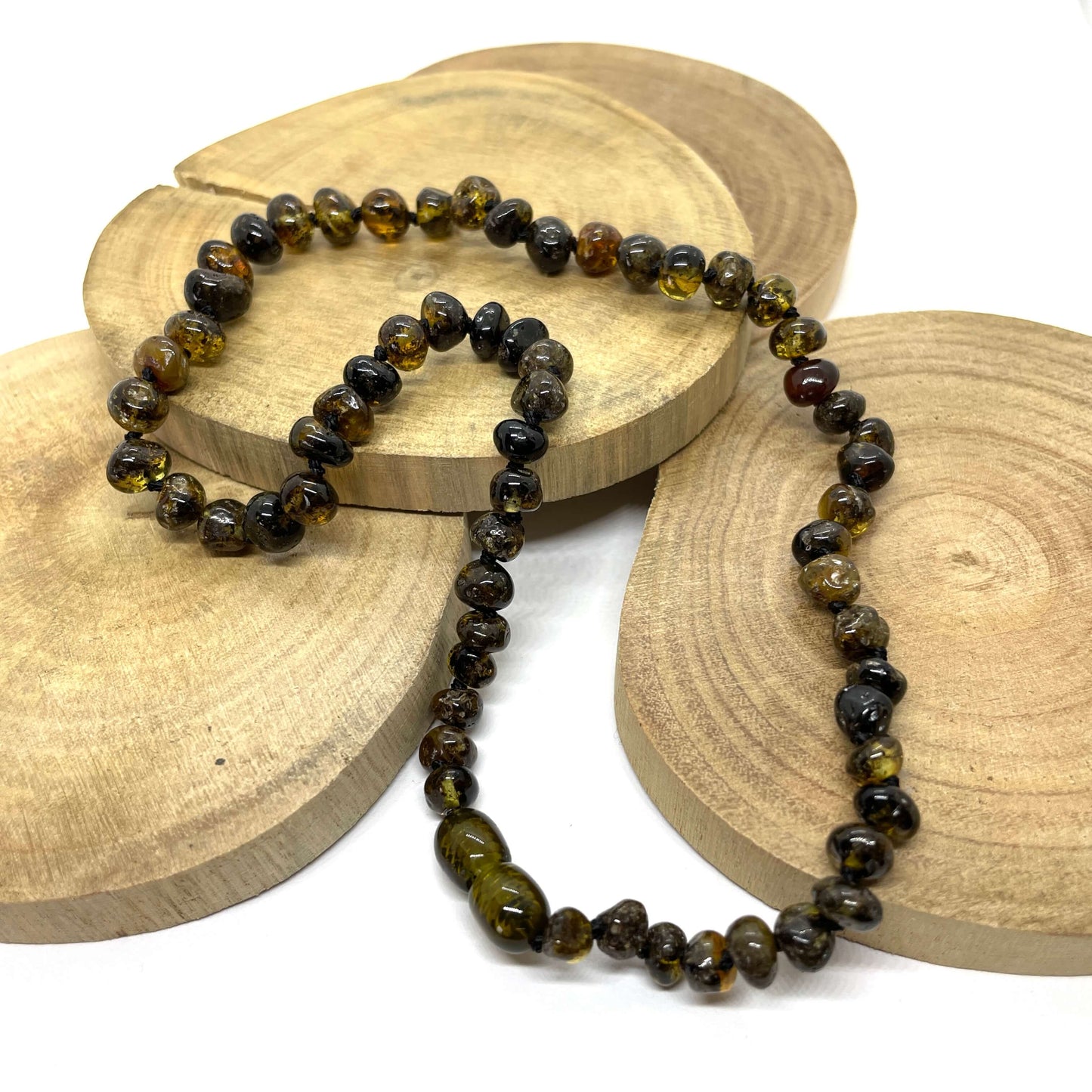 dark green amber beaded necklace with a screw clasp