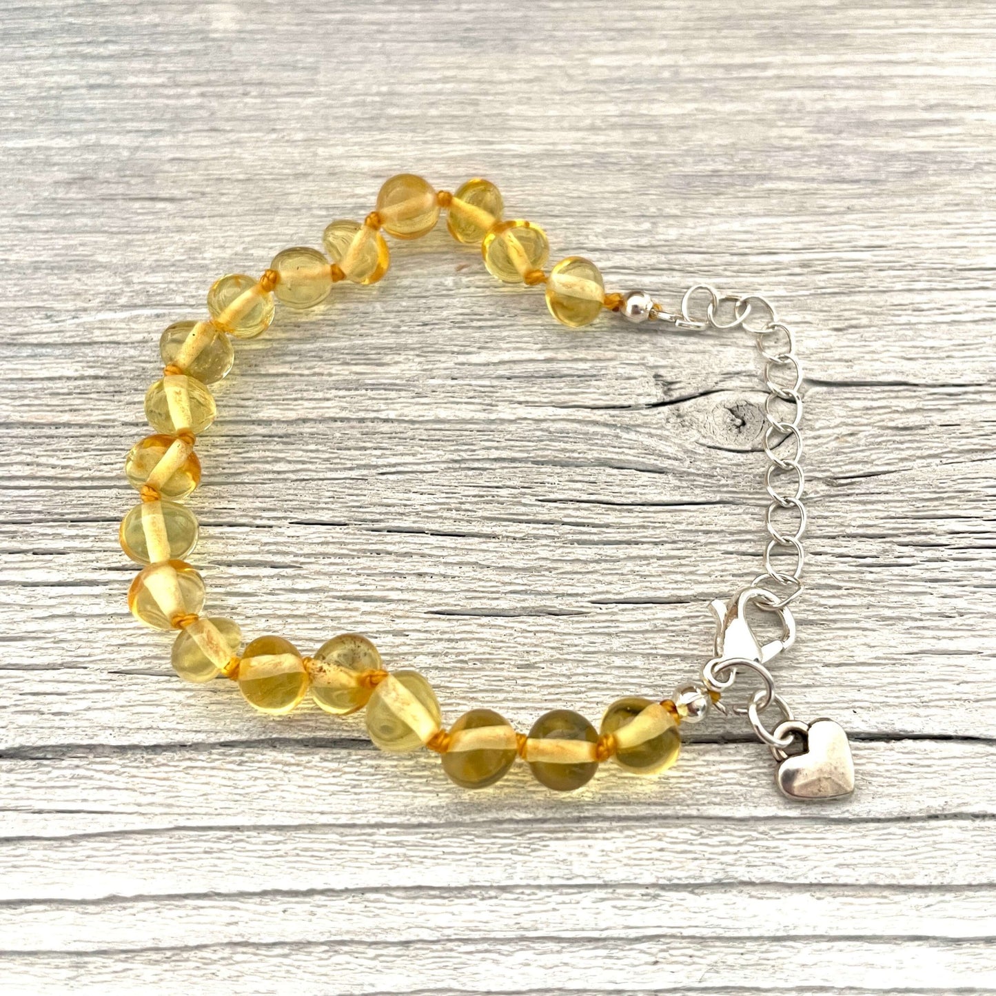 beaded honey amber bracelet with love heart charm
