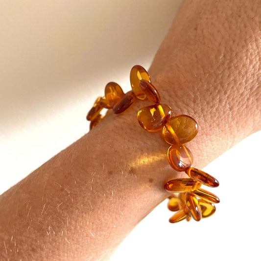 honey coloured beaded amber bracelet on wrist