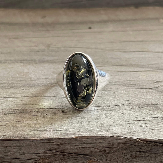 oval shaped green amber ring set in sterling silver front side