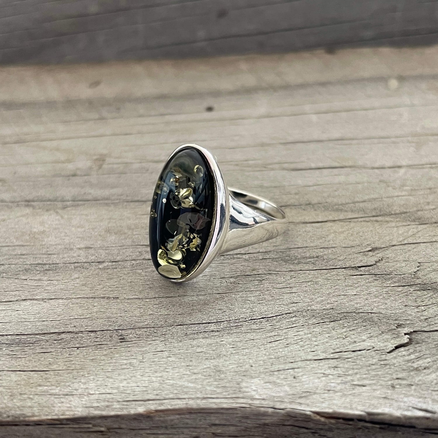 oval shaped green amber ring set in sterling silver right side