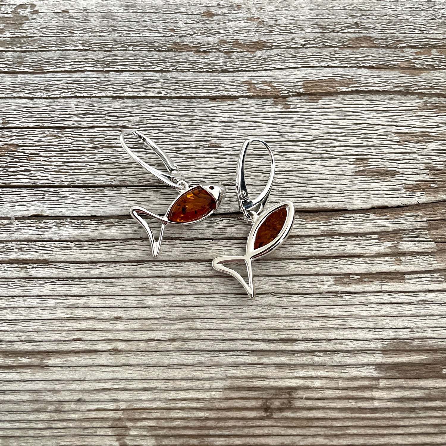lever back fish shaped amber earring set in sterling silver