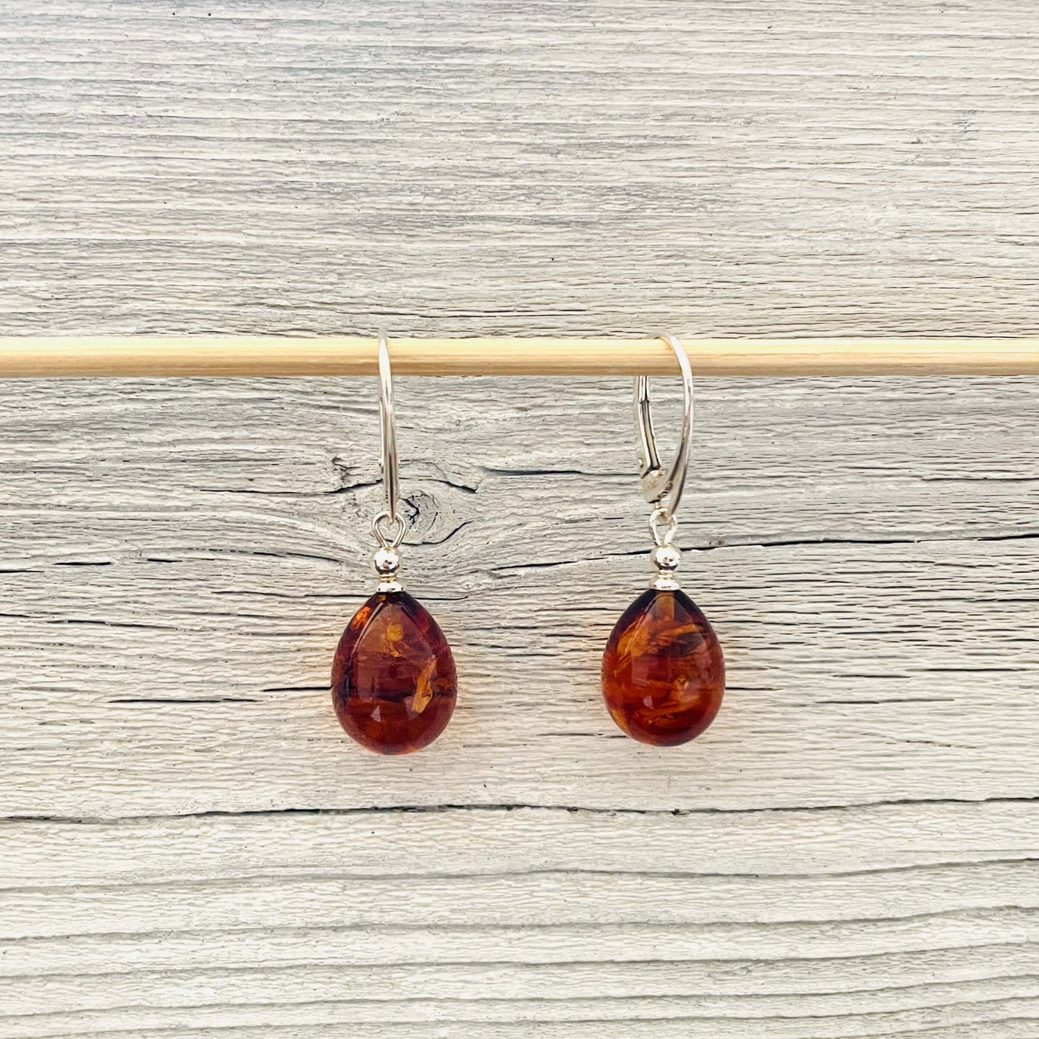 cognac oval shaped ball amber earrings with leverbacks