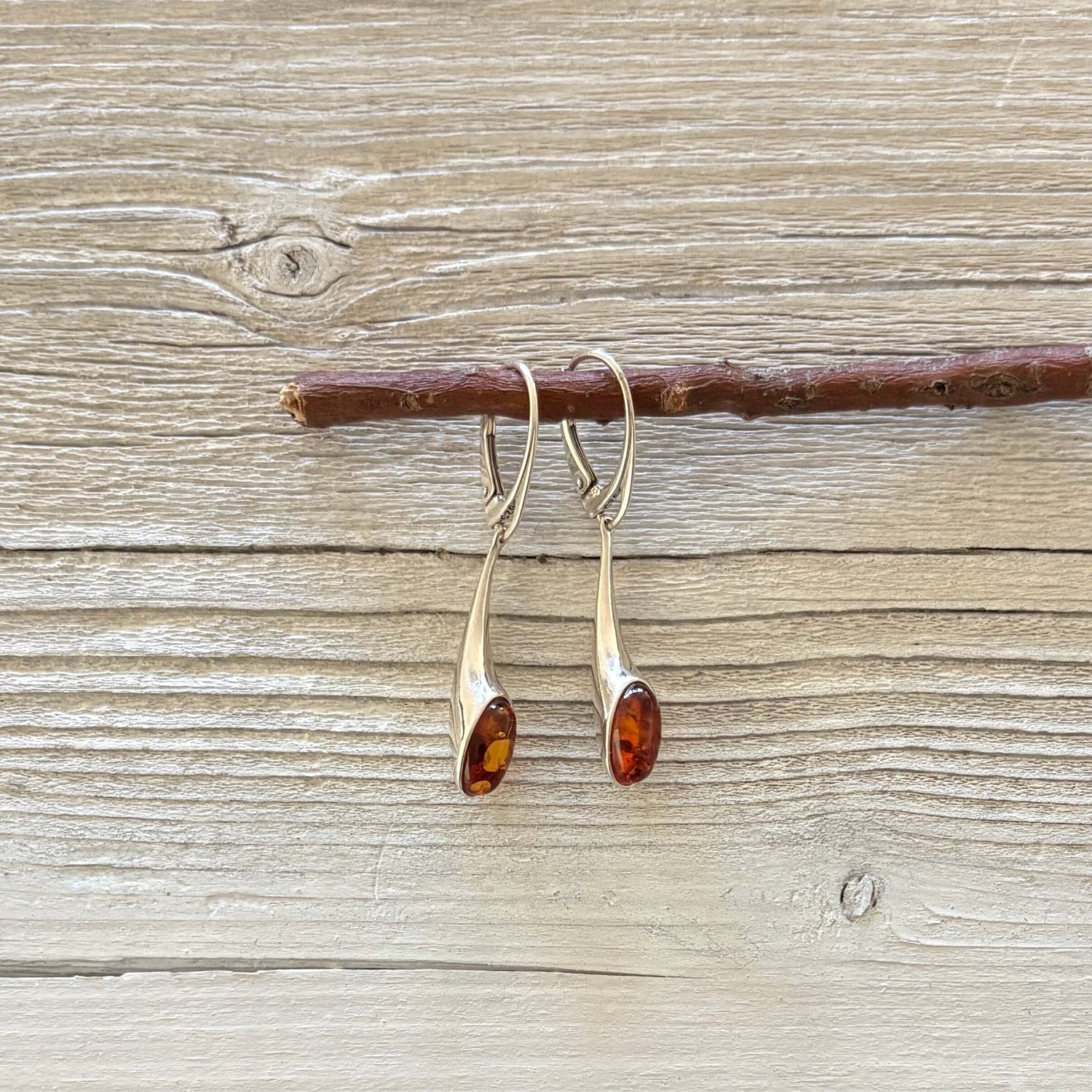Genuine Baltic amber earrings set in polished sterling silver