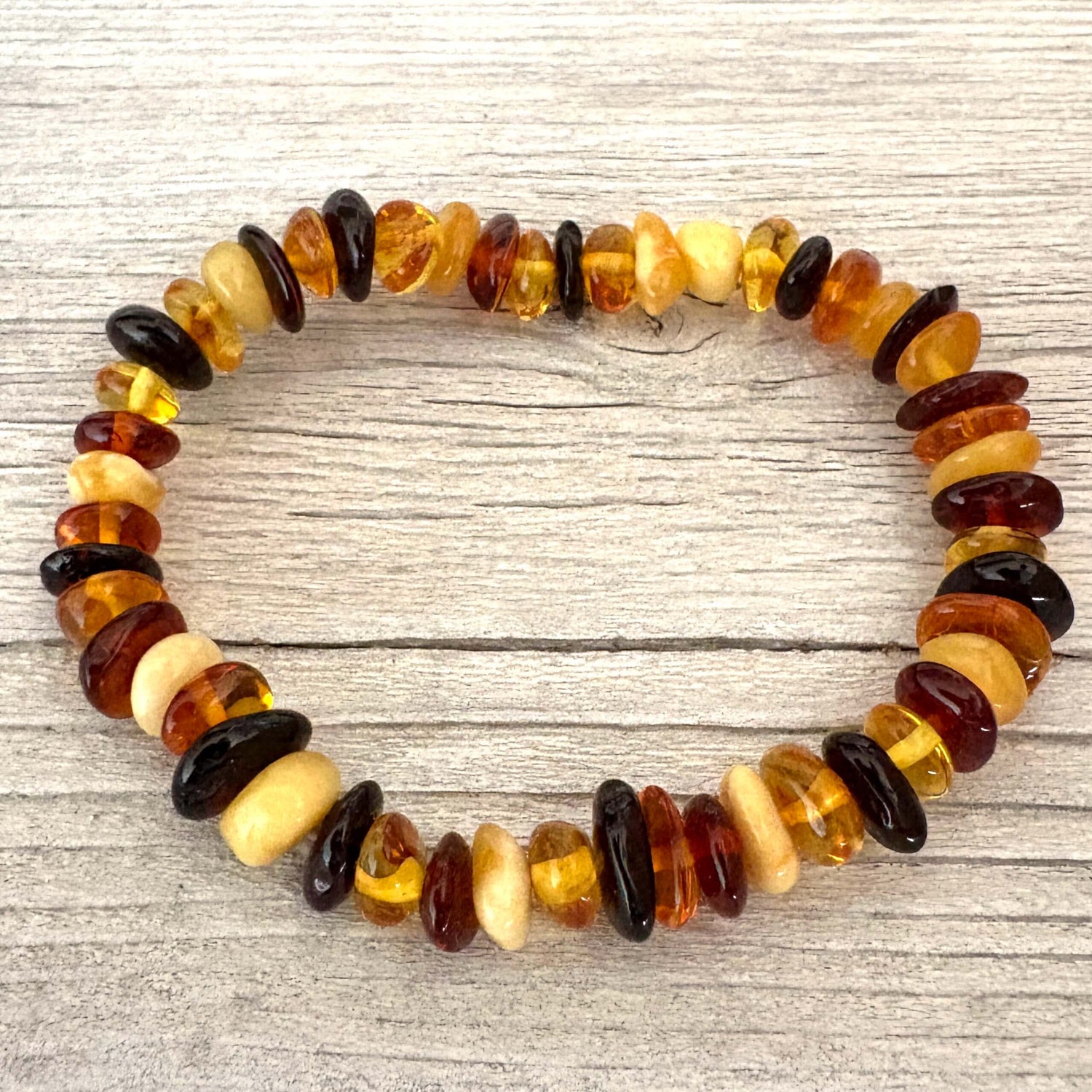 Multicolored beaded bracelet on a wooden surface