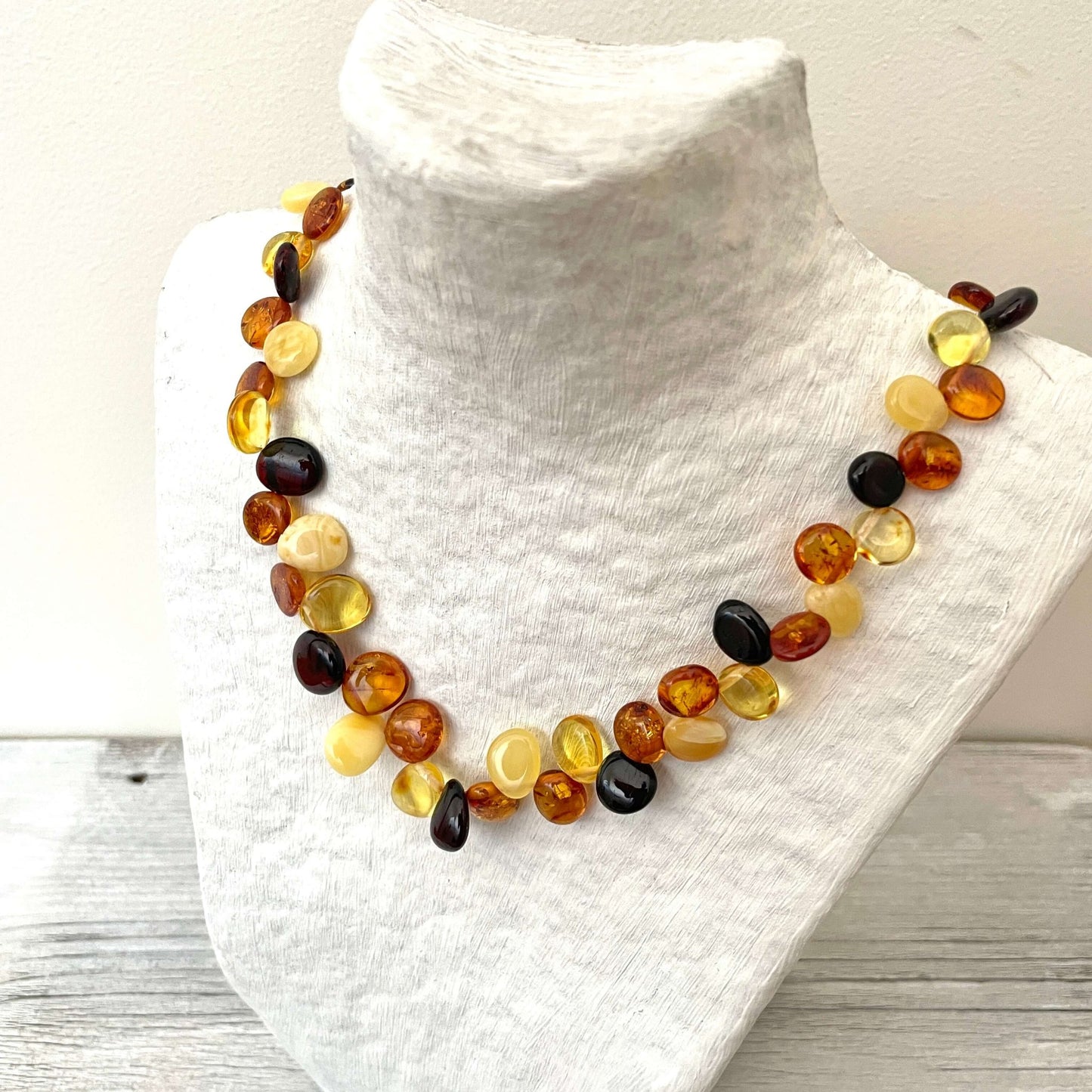 mixed amber necklace with screw clasp on angle