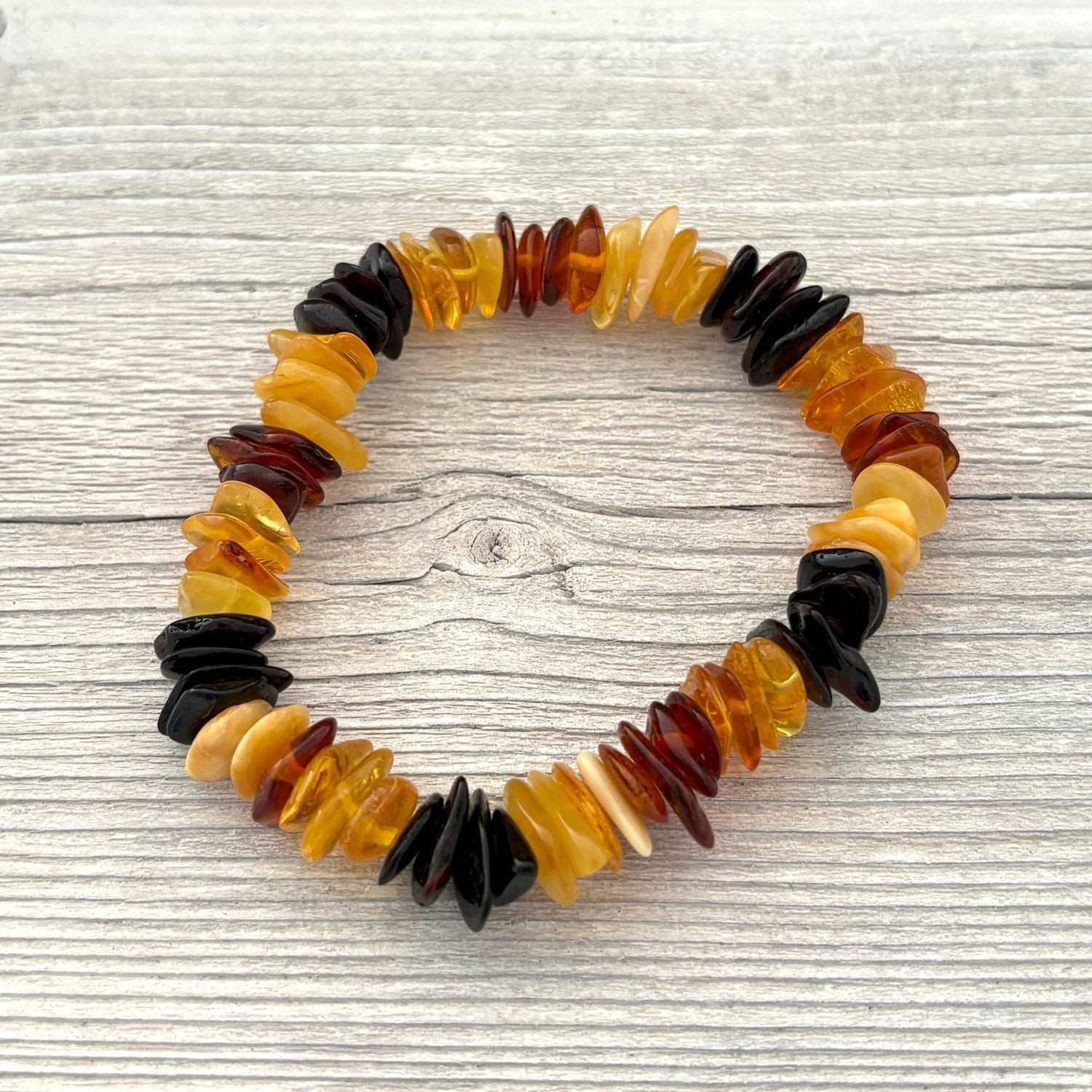 Multicolored beaded bracelet on a wooden surface