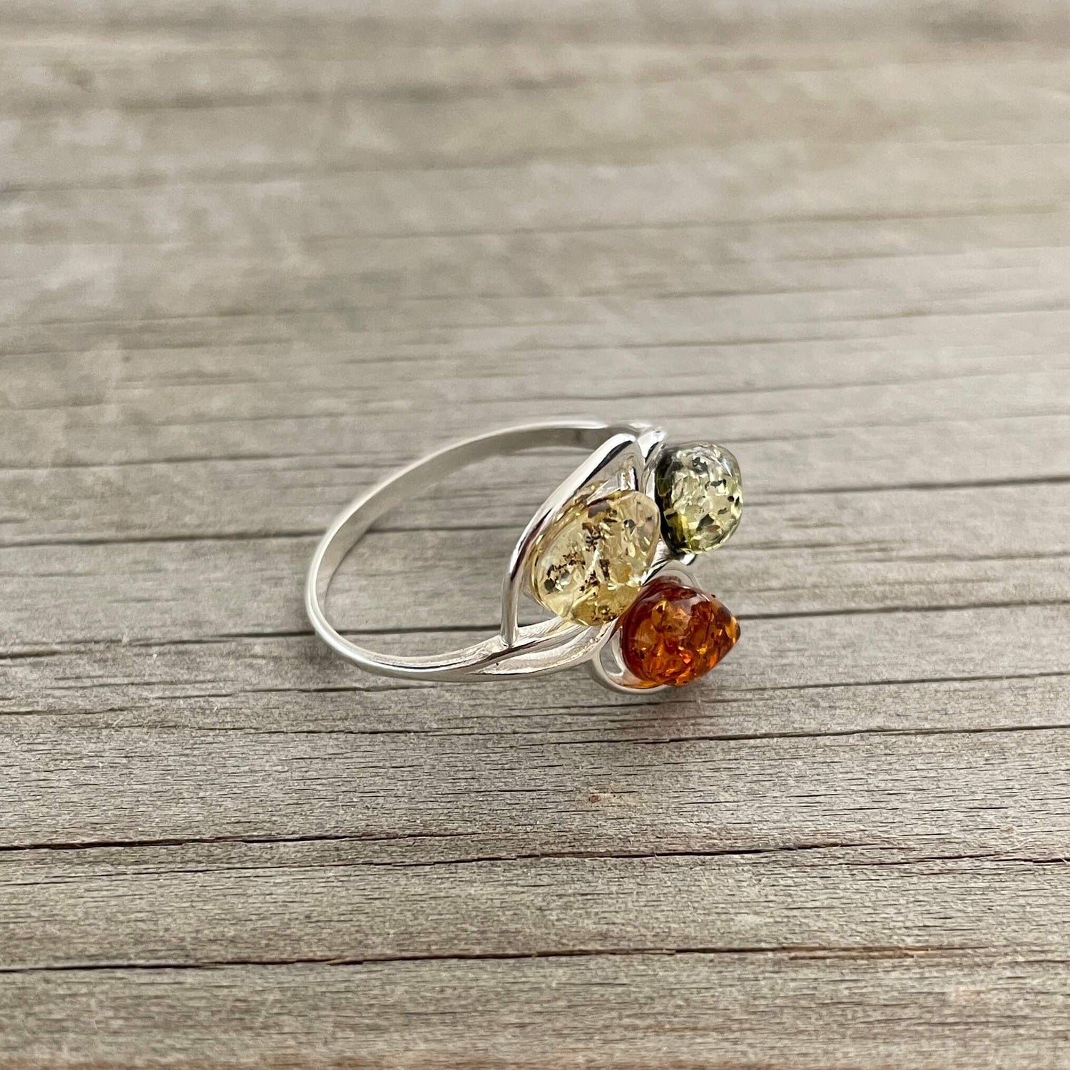 egg shaped yellow green and cognac amber silver ring