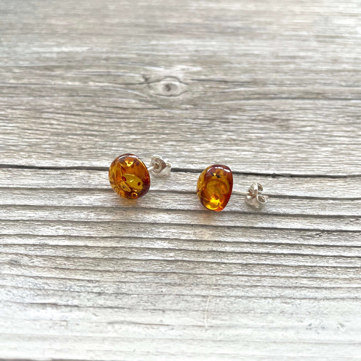 polished round amber stud earrings