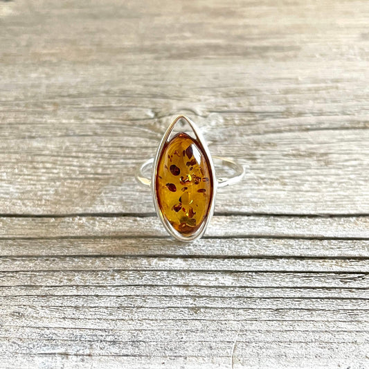 cognac oval shaped amber rig set in sterling silver
