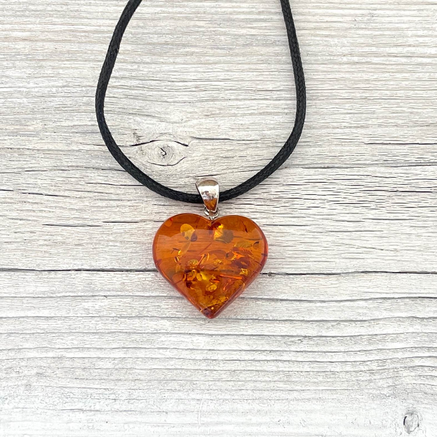 cognac coloured love heart shaped amber pendant