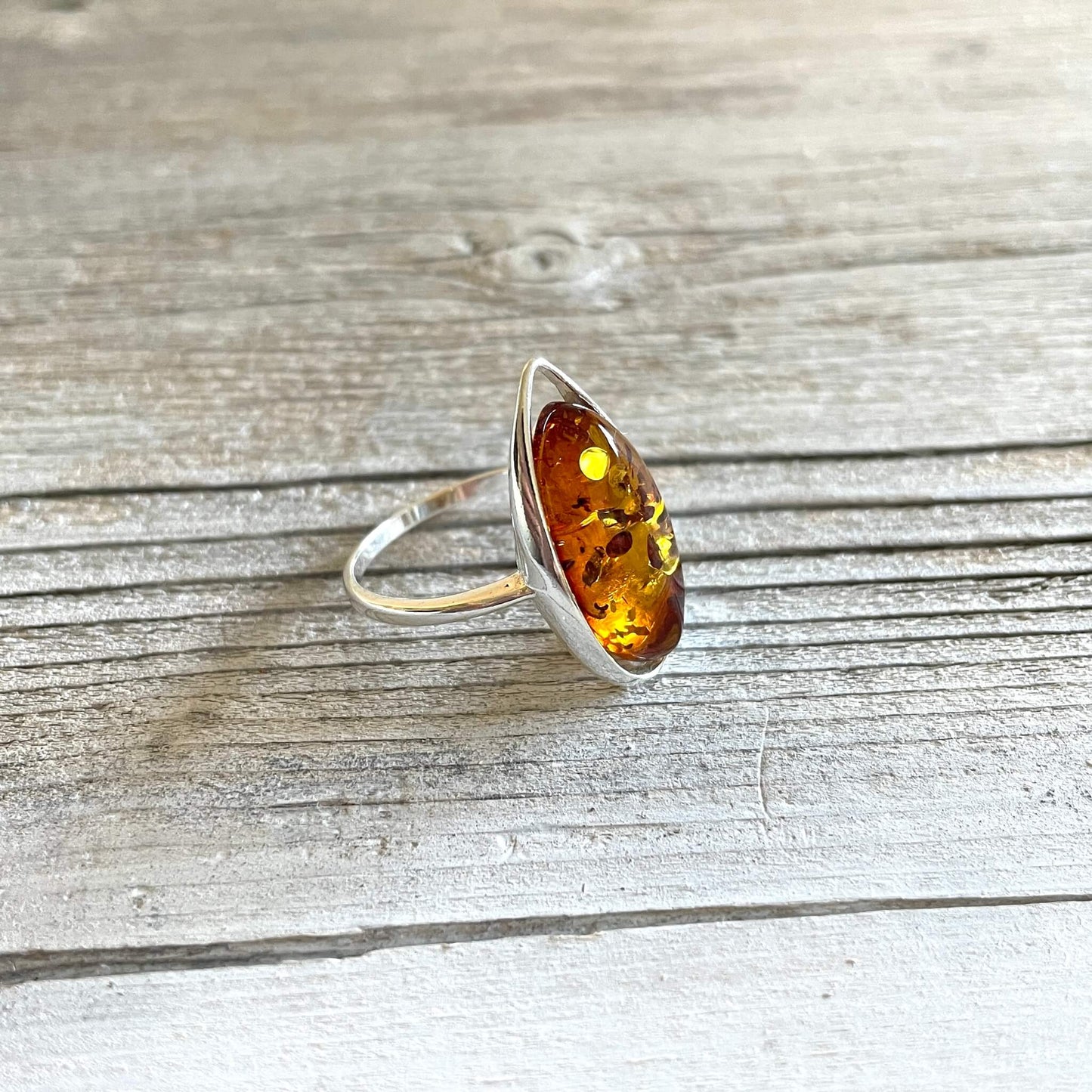 oval shaped cognac coloured amber ring left side