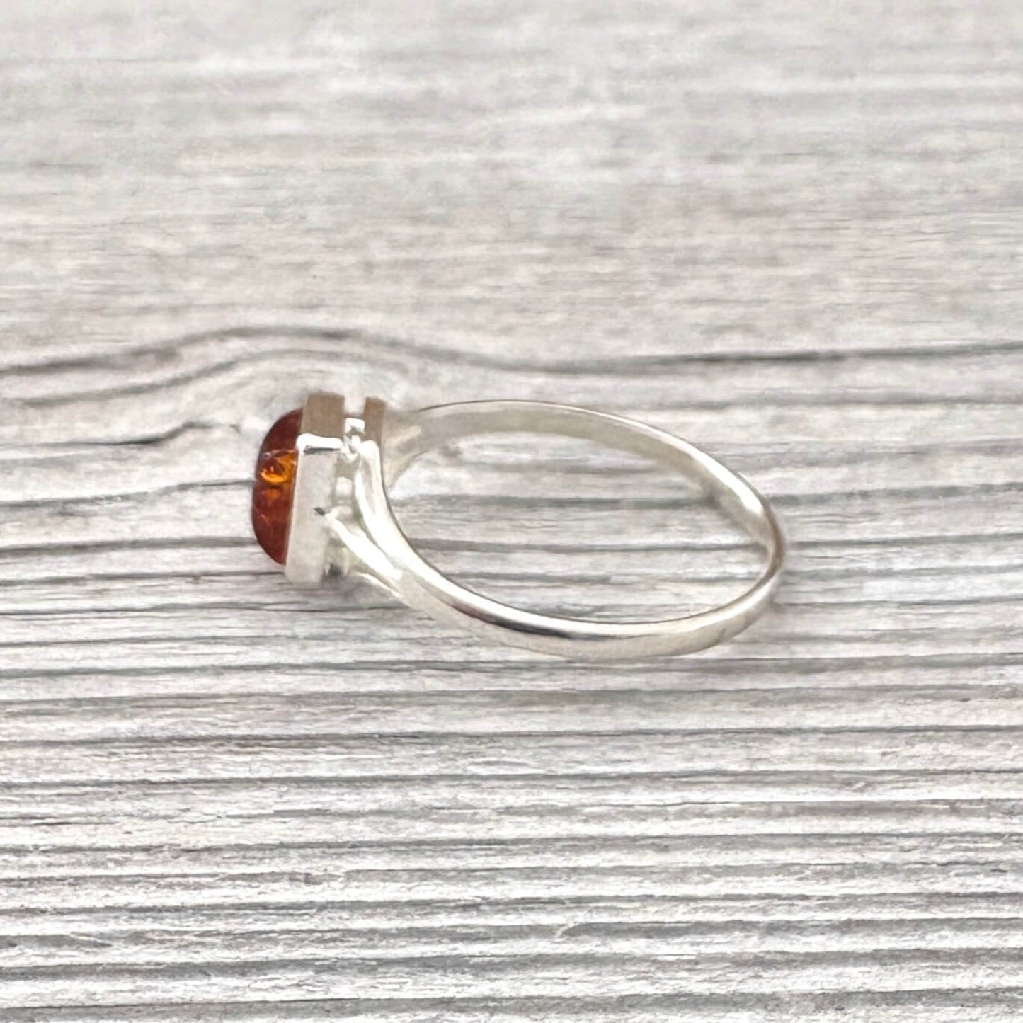 sterling silver ring with a rectangular  amber stone 