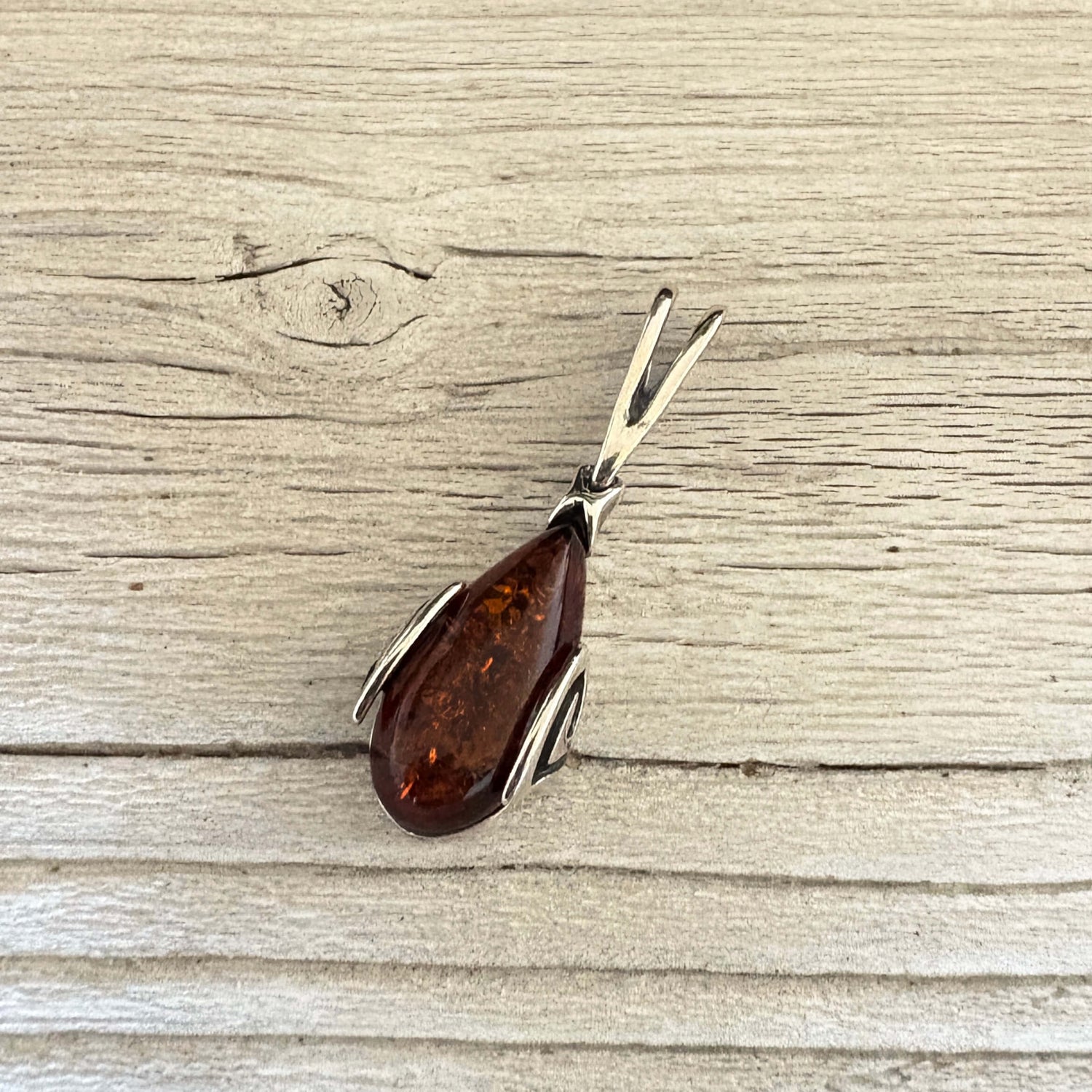 Sterling silver amber pendant with silver bail 