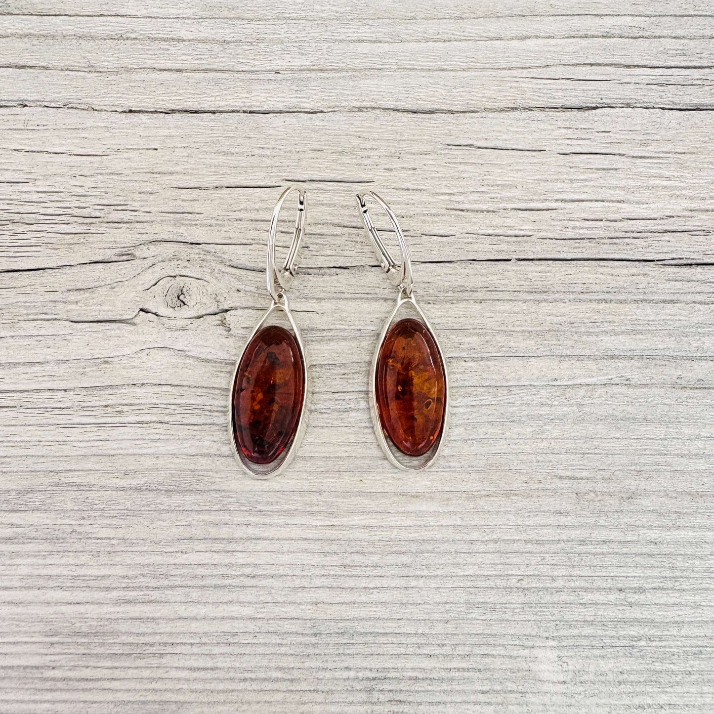 oval shaped cognac leverback amber earrings set in sterling silver