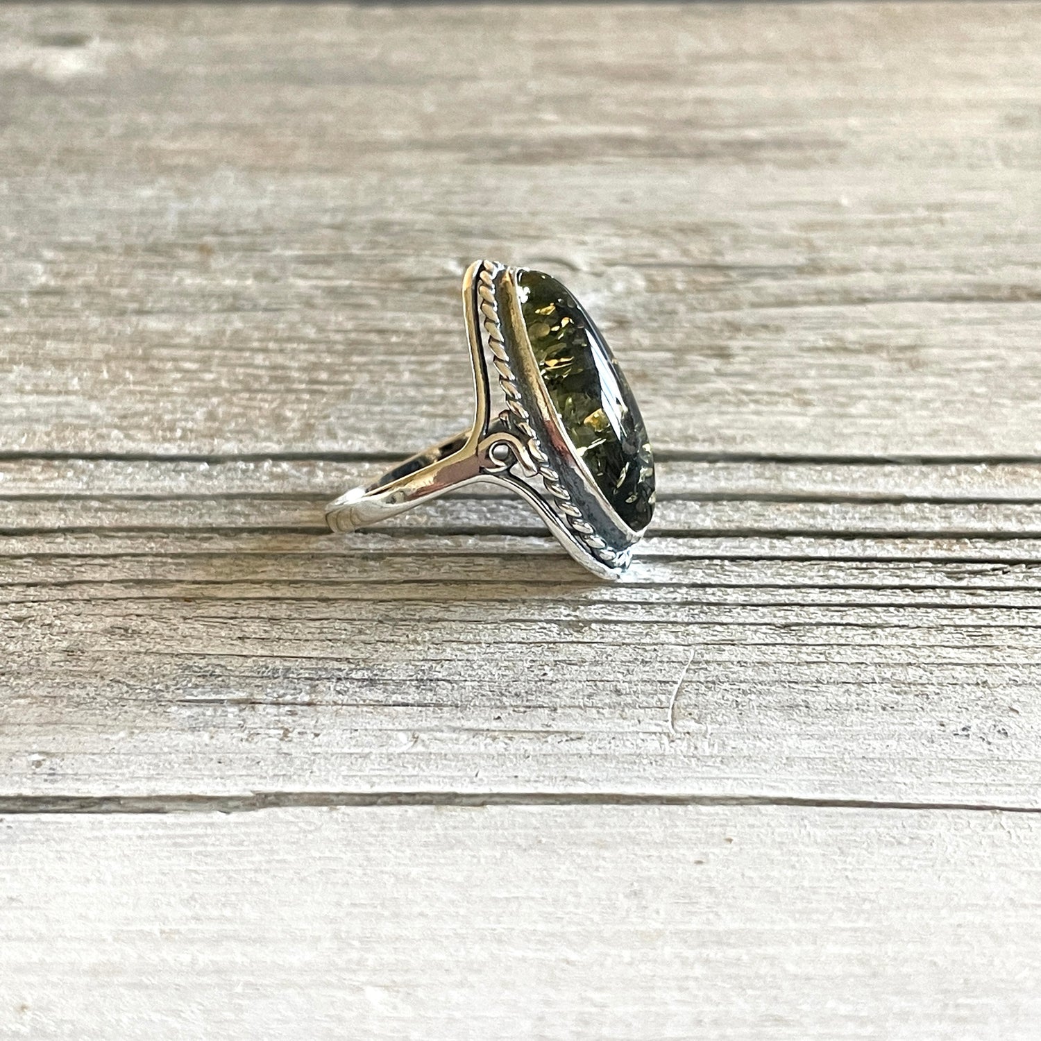 oval shaped green amber sterling silver ring left side