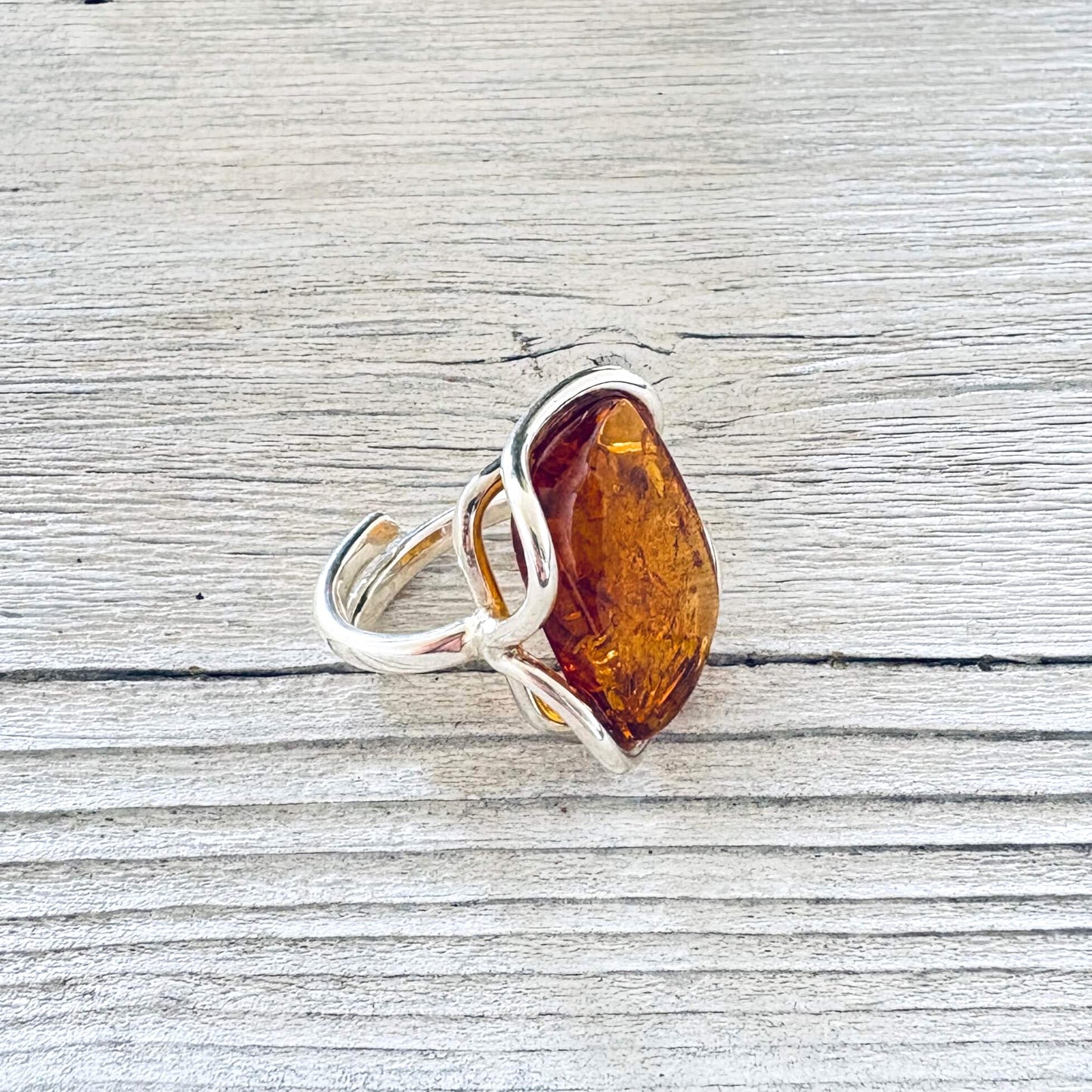 Side profile of Baltic amber statement ring with square shaped amber stone