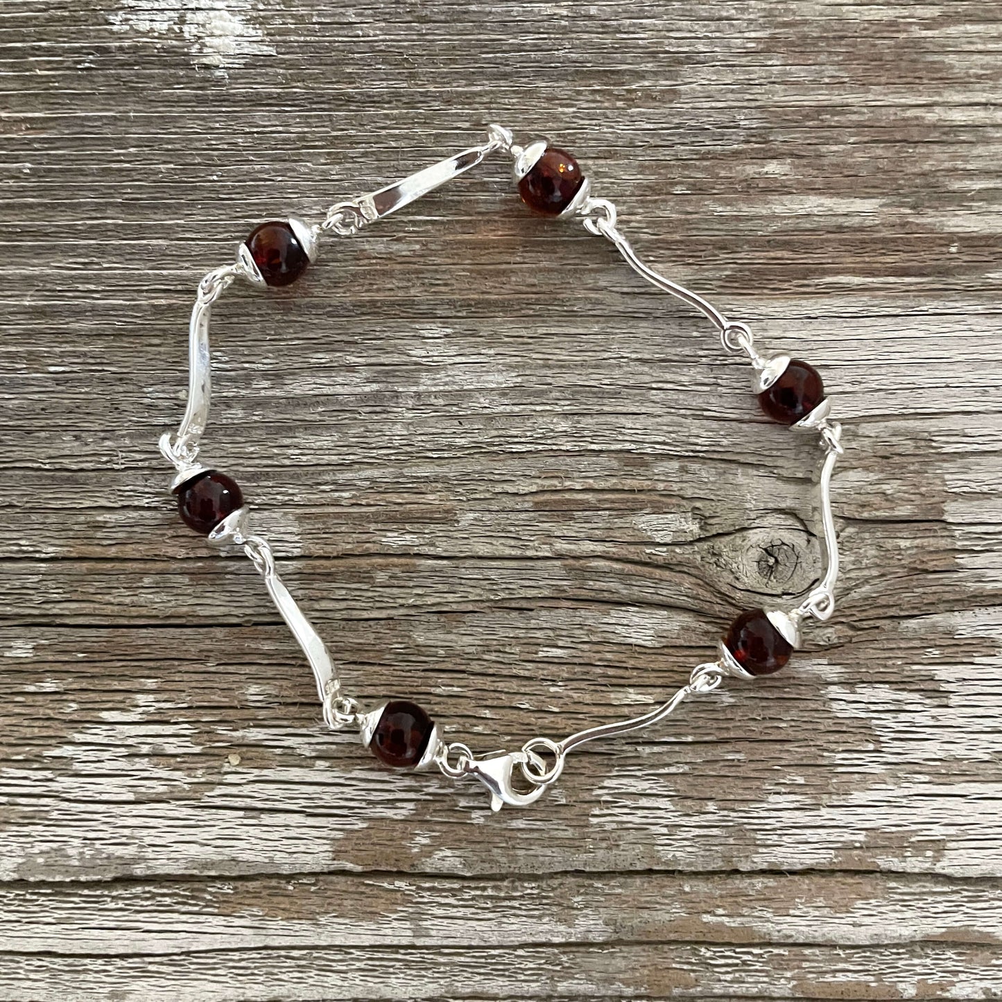 Sterling silver bracelet with round cognac amber set in sterling silver