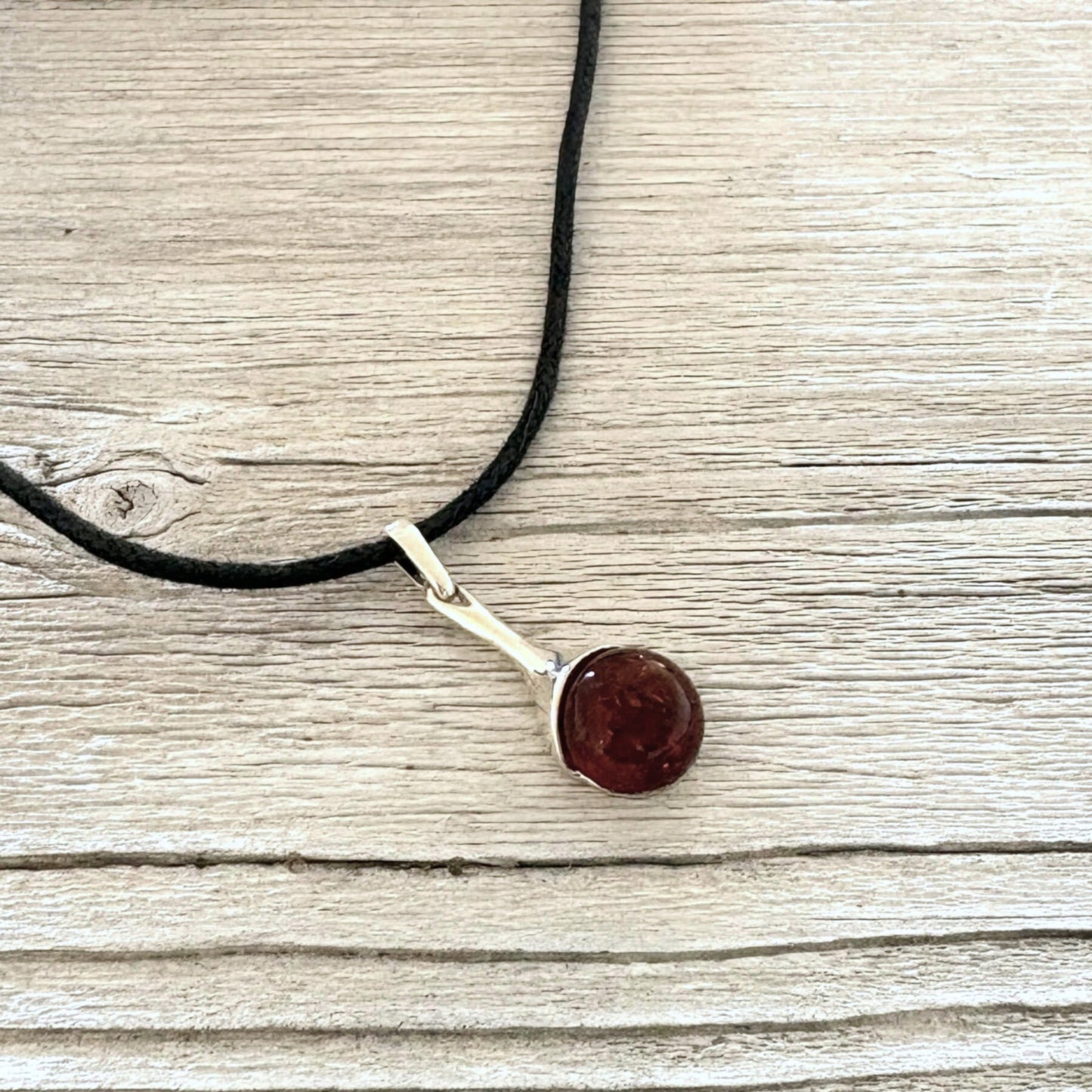 Elegant sterling silver amber pendant with natural cognac amber stone.