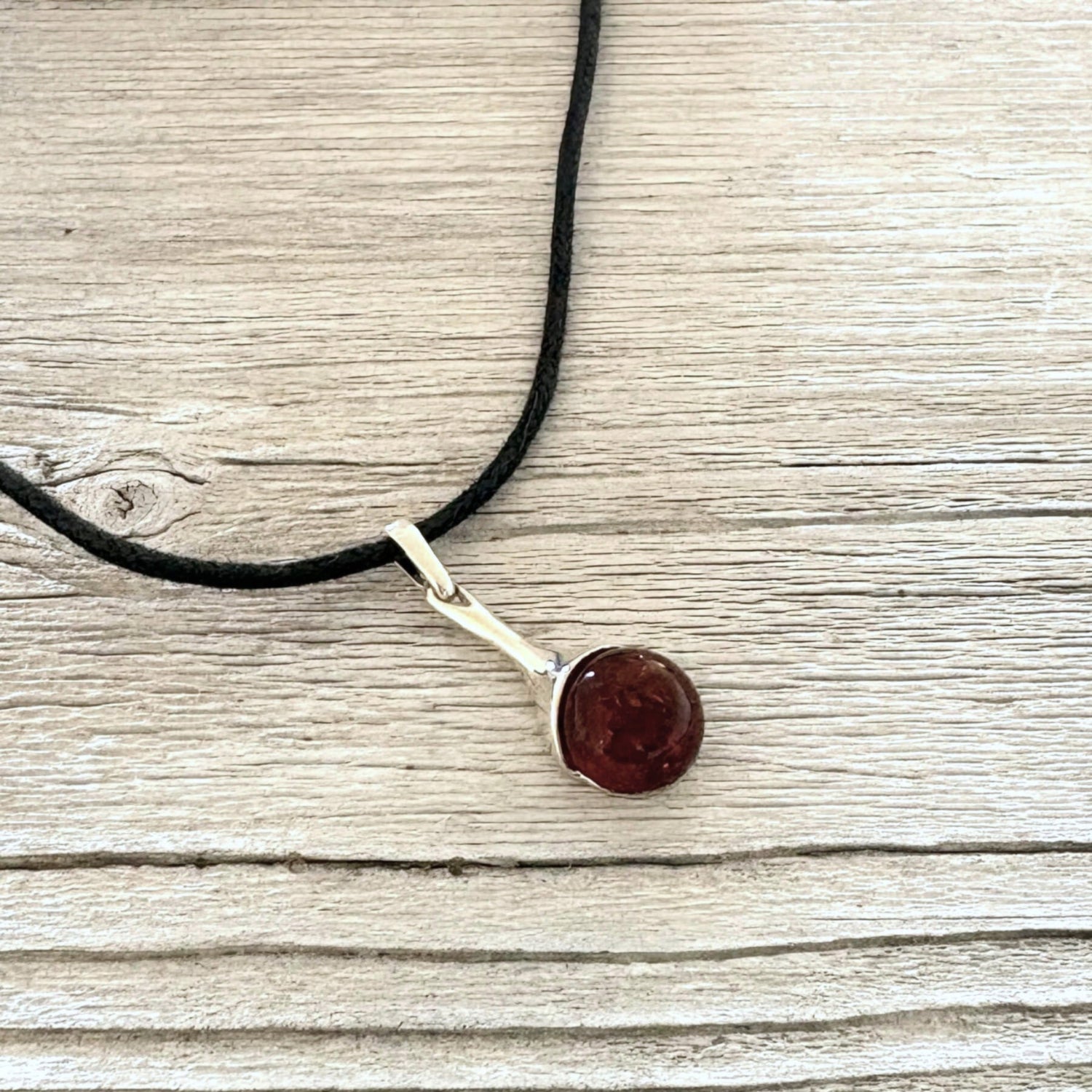 Elegant sterling silver amber pendant with natural cognac amber stone.