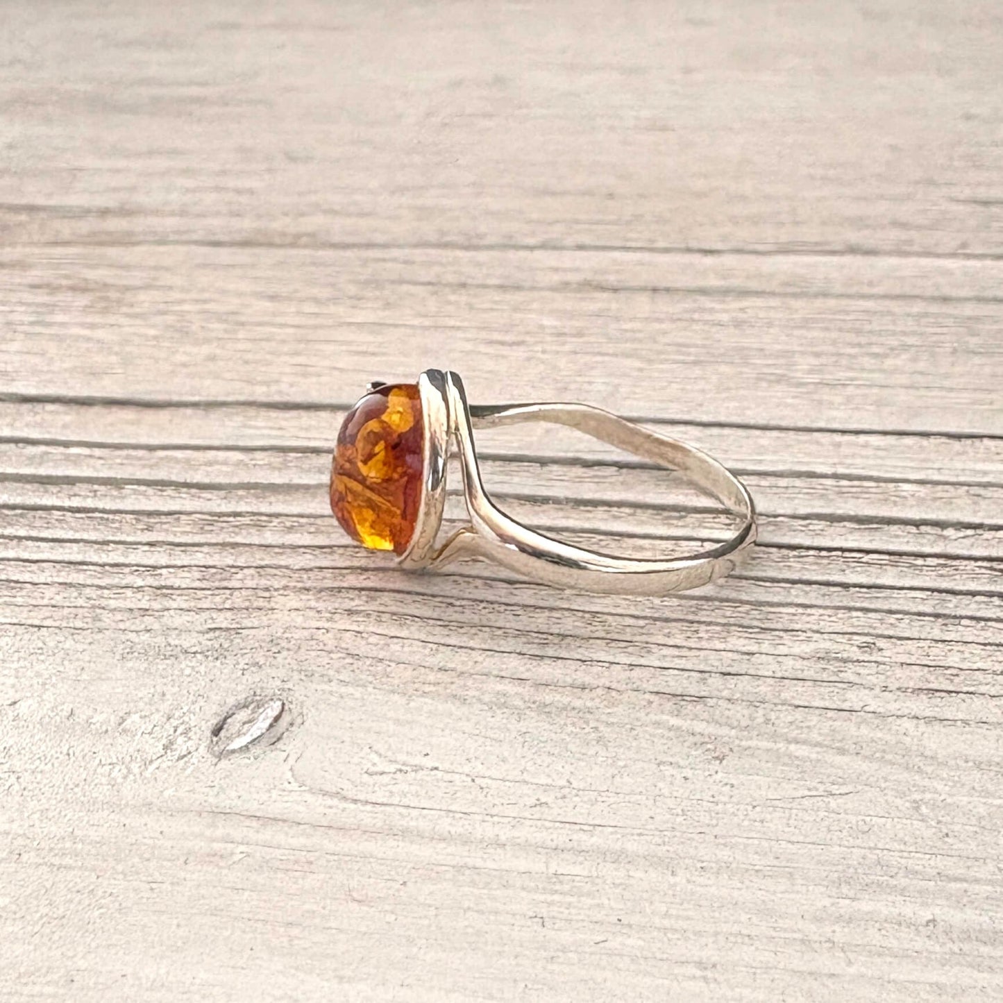 Oval cognac Baltic amber ring set in sterling silver