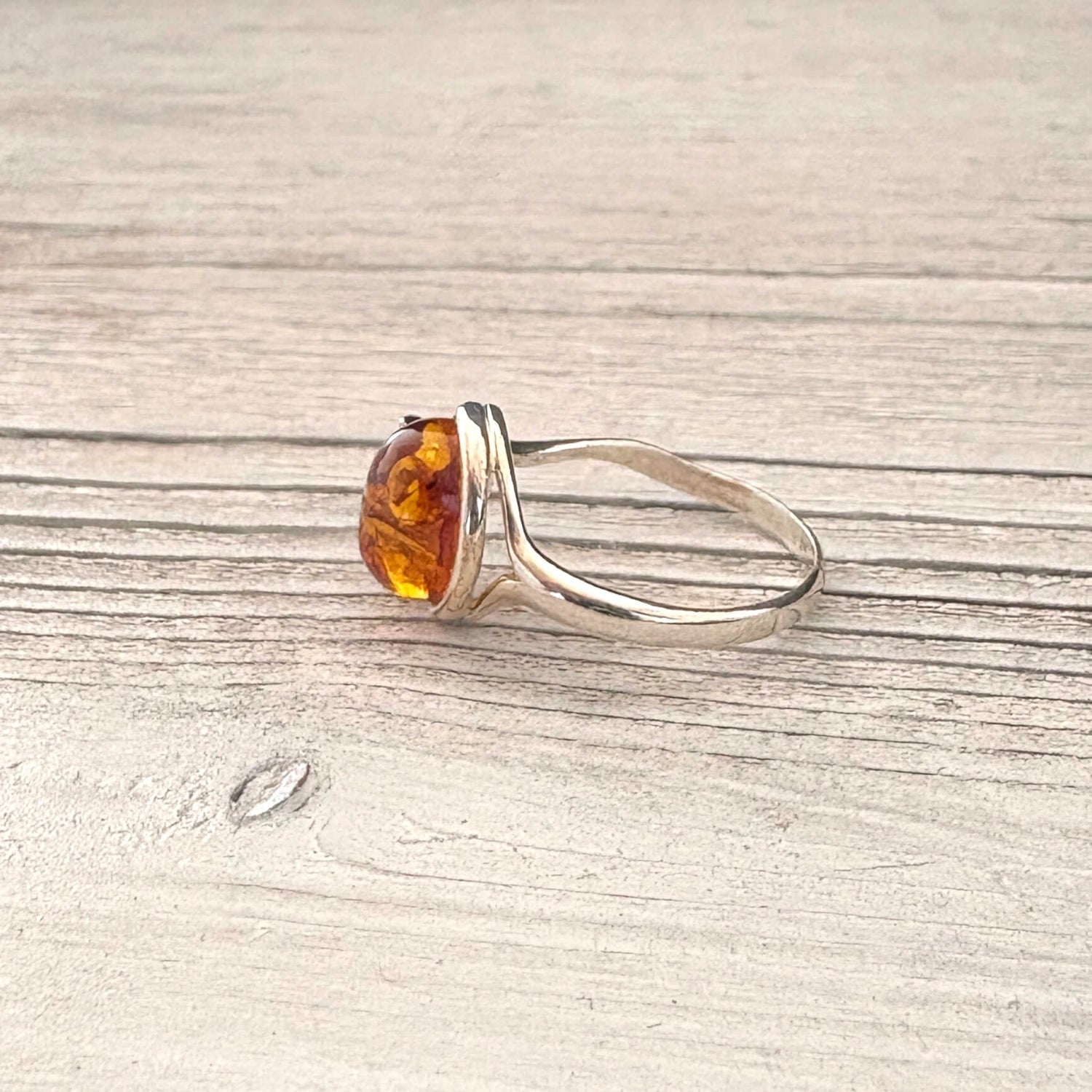 Oval cognac Baltic amber ring set in sterling silver