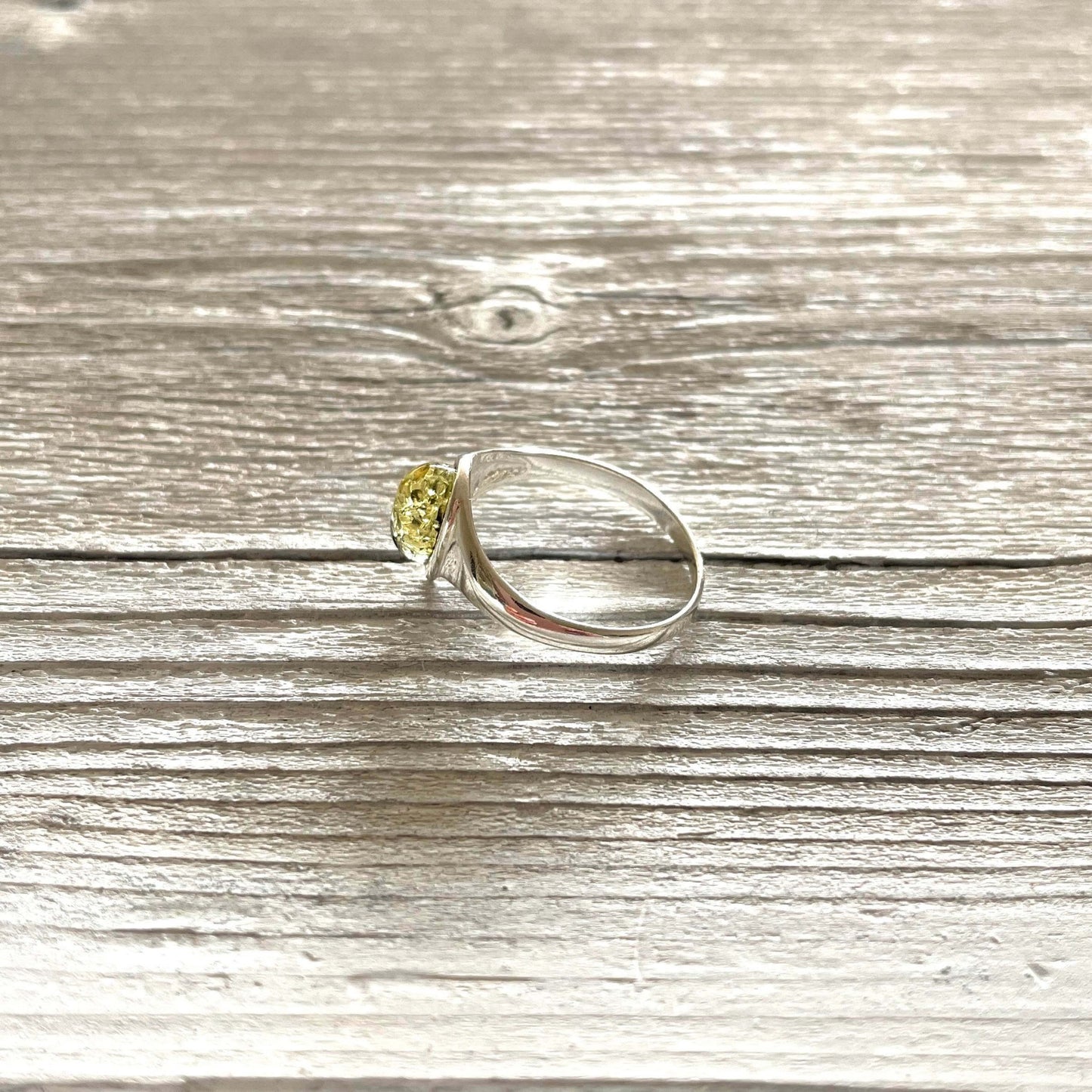 tear drop shaped green amber ring set in sterling silver left side