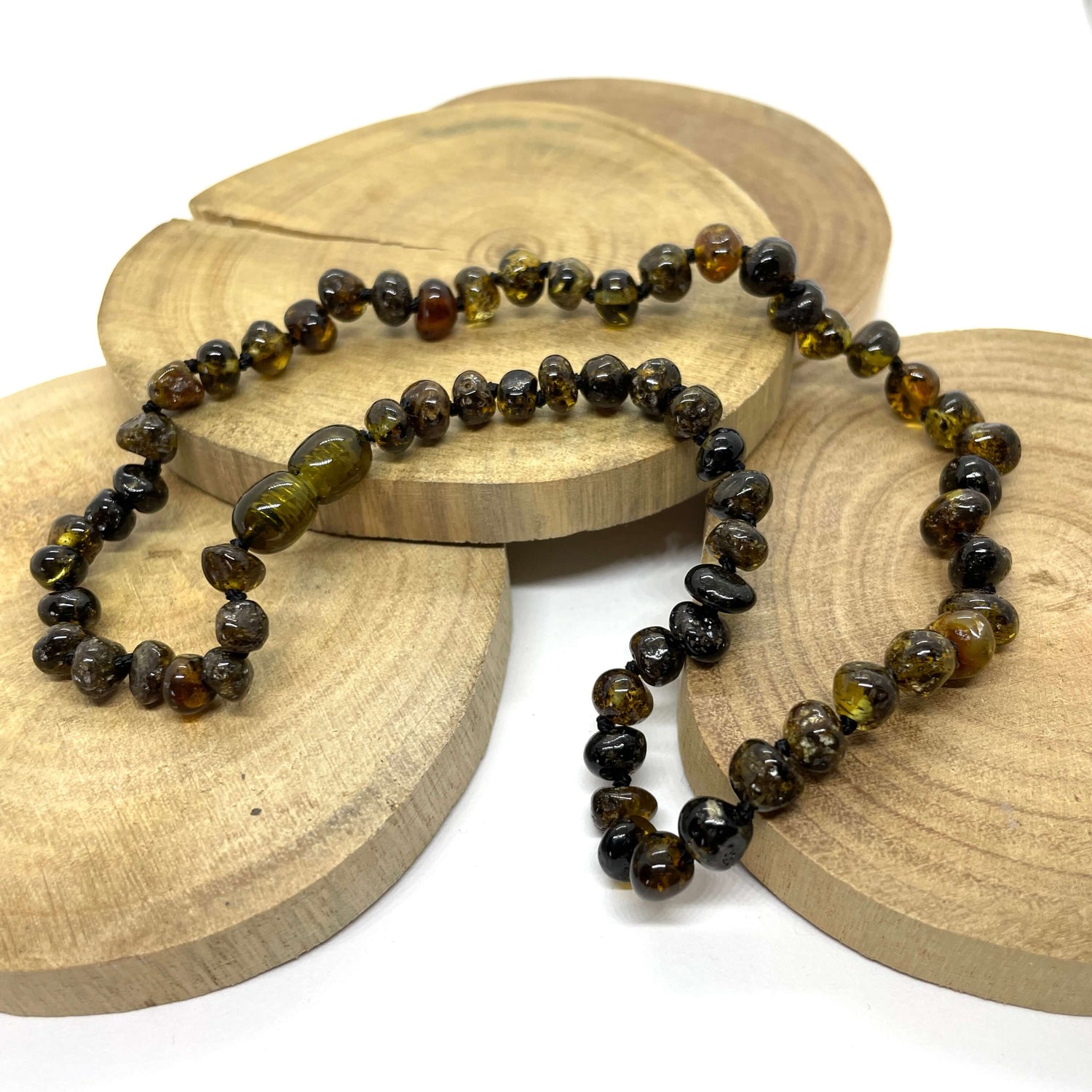 dark green amber beaded necklace with a screw clasp