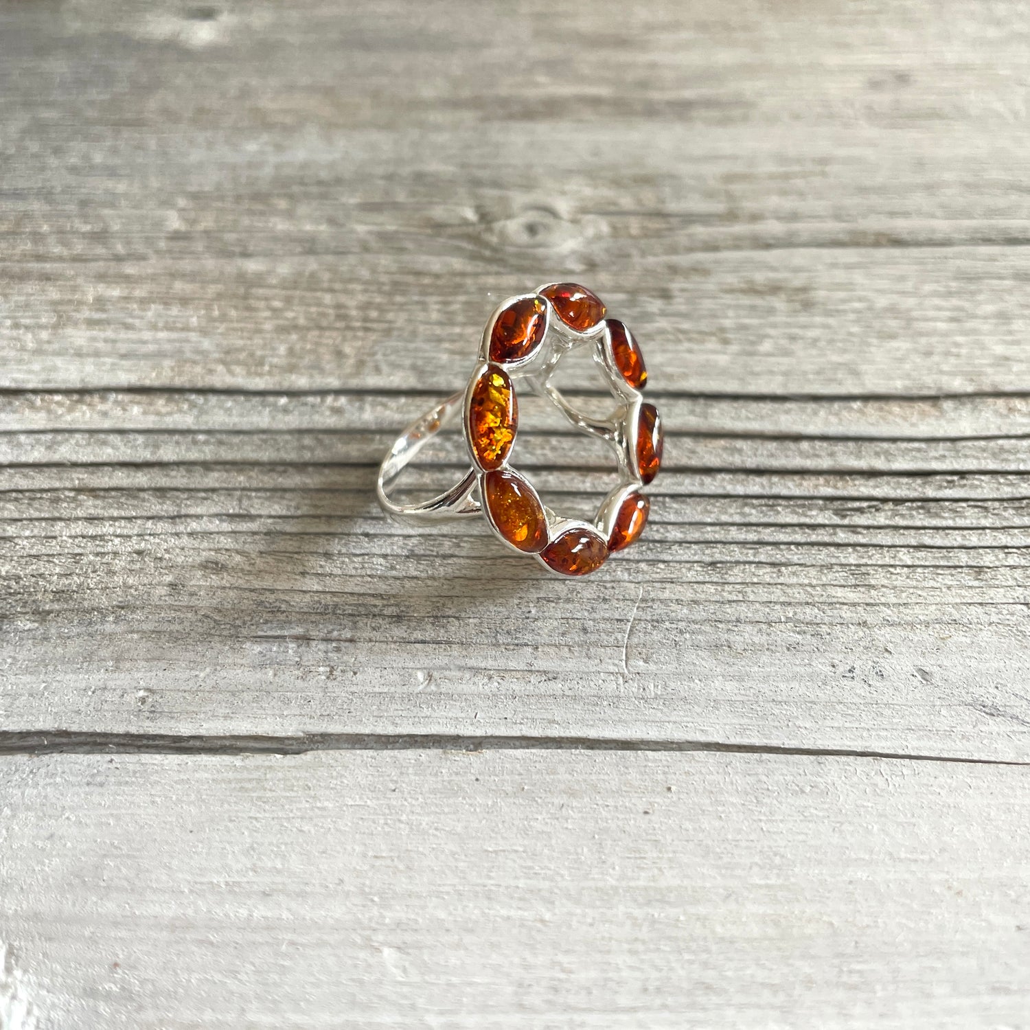 round cognac amber ring set in sterling silver left side