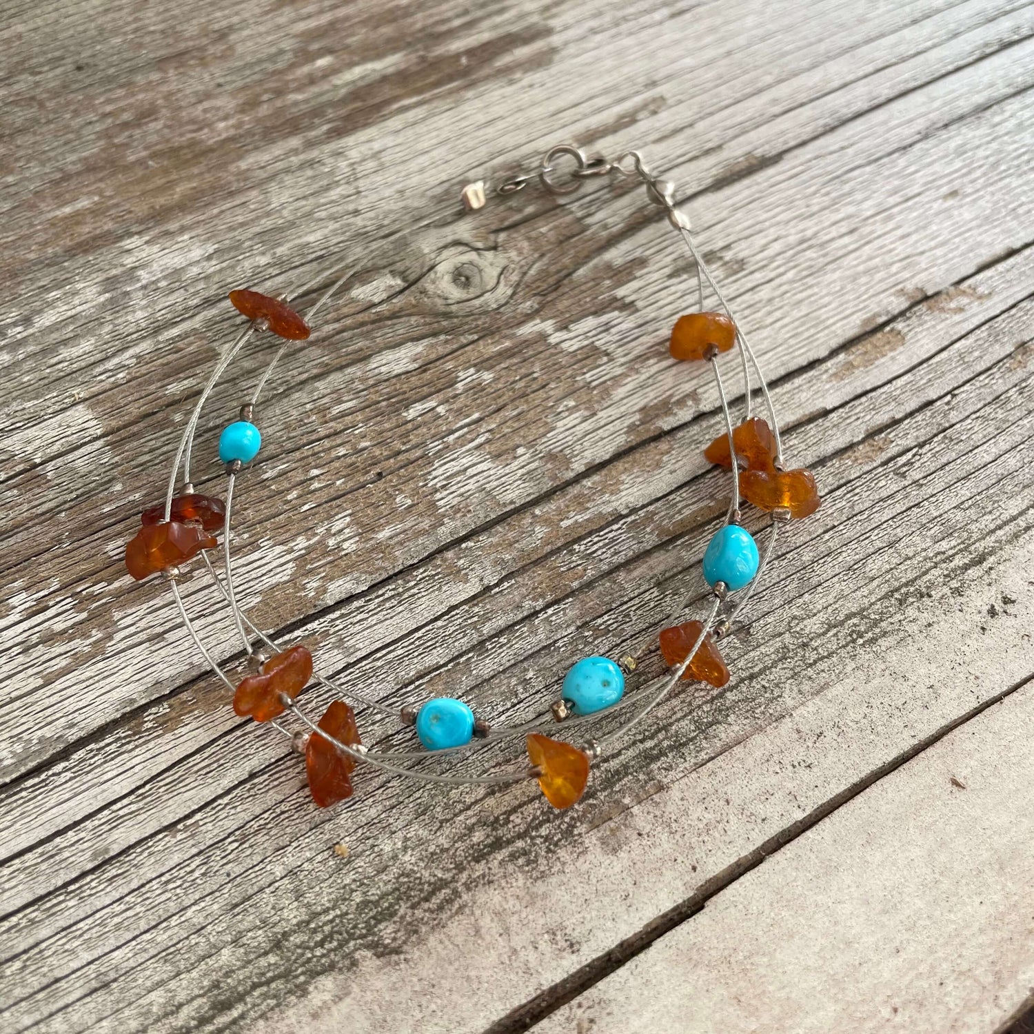 Three strand amber and turquoise bracelet with lobster claw