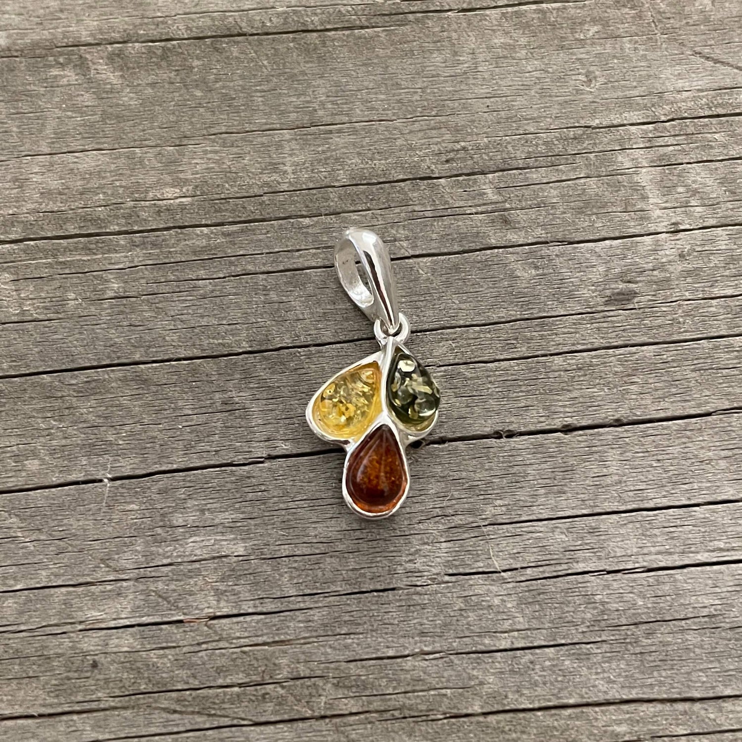 green, yellow and cognac amber pendant set in sterling silver