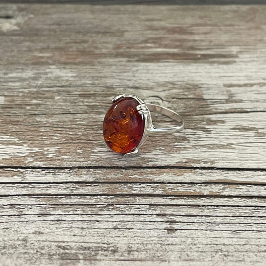 egg shaped cognac amber ring set in sterling silver
