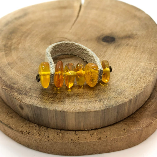 natural Baltic cognac amber with tan leather ring