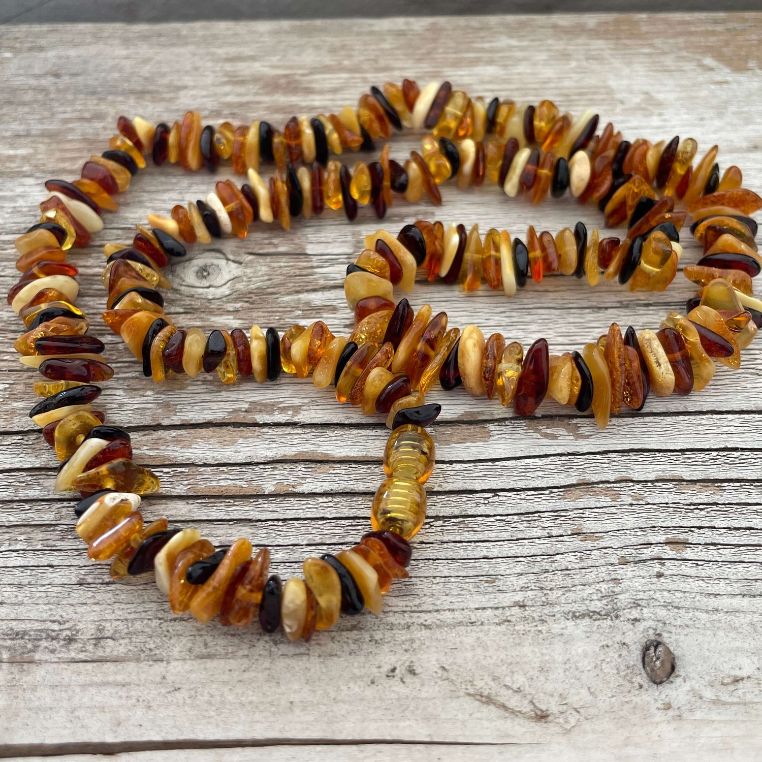 Multi coloured polished beaded amber necklace