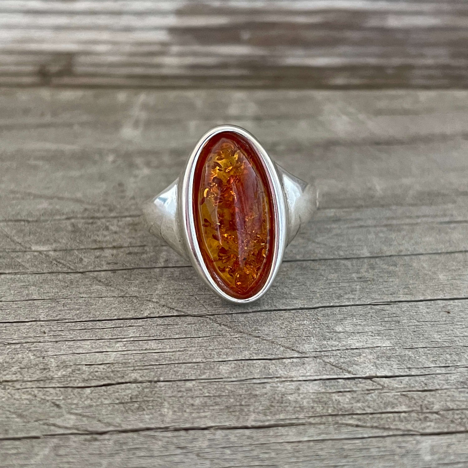 oval shaped cognac amber set in sterling silver ring