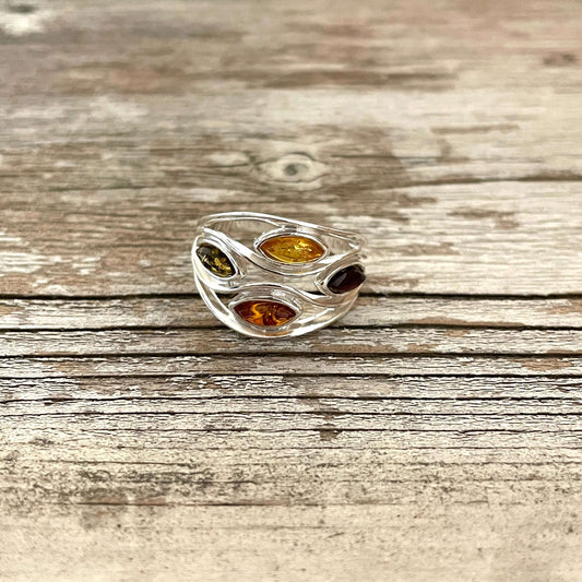 mixed coloured oval shaped green honey cognac and cherry amber sterling silver ring