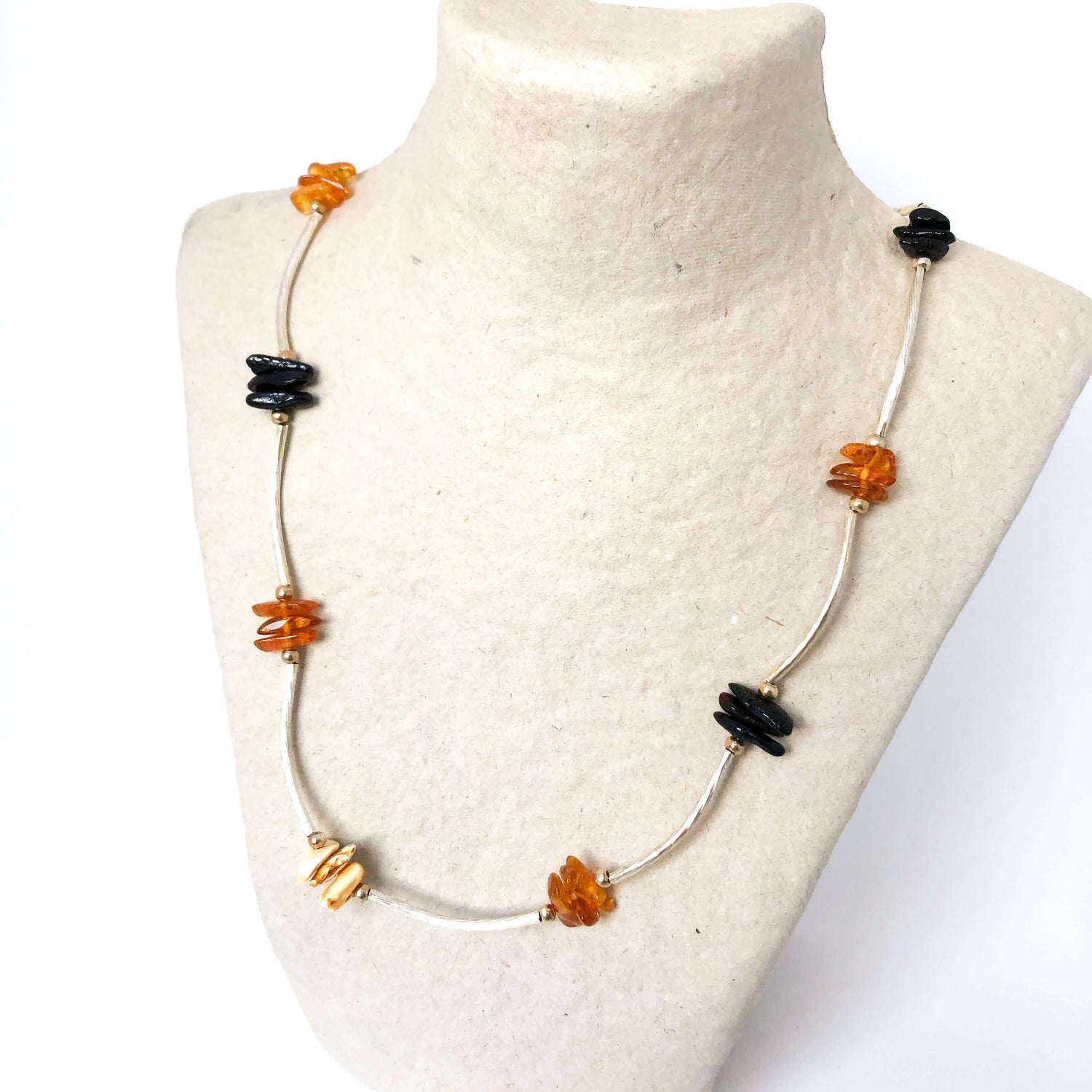 silver tone necklace with cherry cognac and butterscotch amber