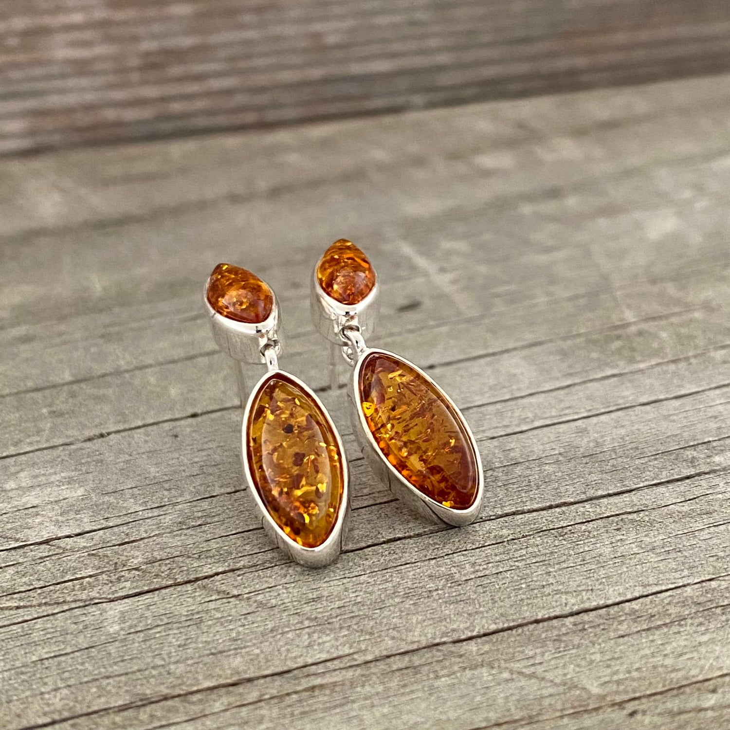 cognac coloured amber drop earrings close up